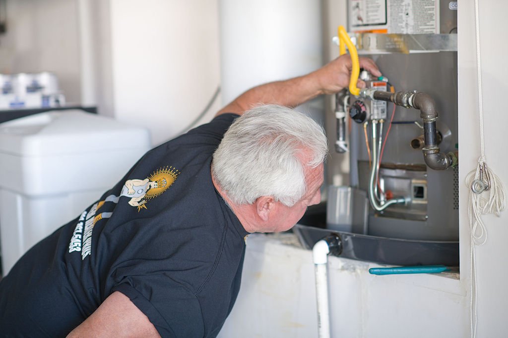 Water Heater Pro Technician inspecting water heater